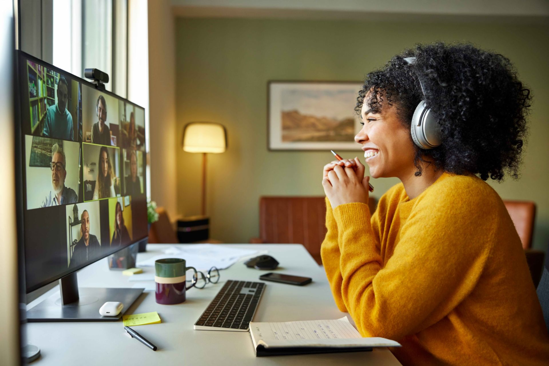 Woman in home office having a call with colleagues