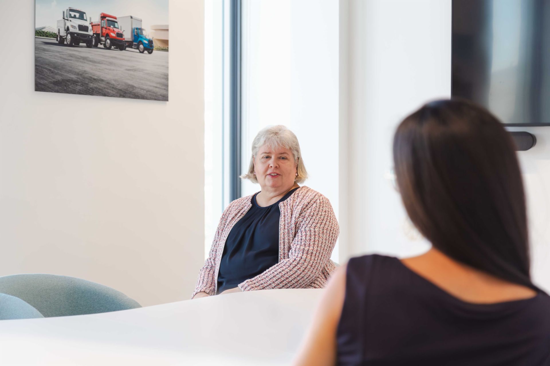Frédérique Klein talks to a colleague
                 